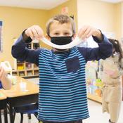 school age child plays with slime