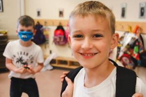 Two little boys smiling